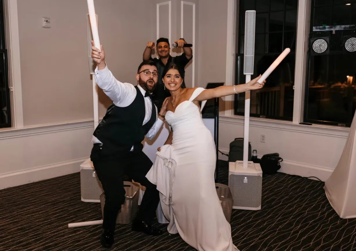 Wedding event guests gathered in a warmly lit celebration space
